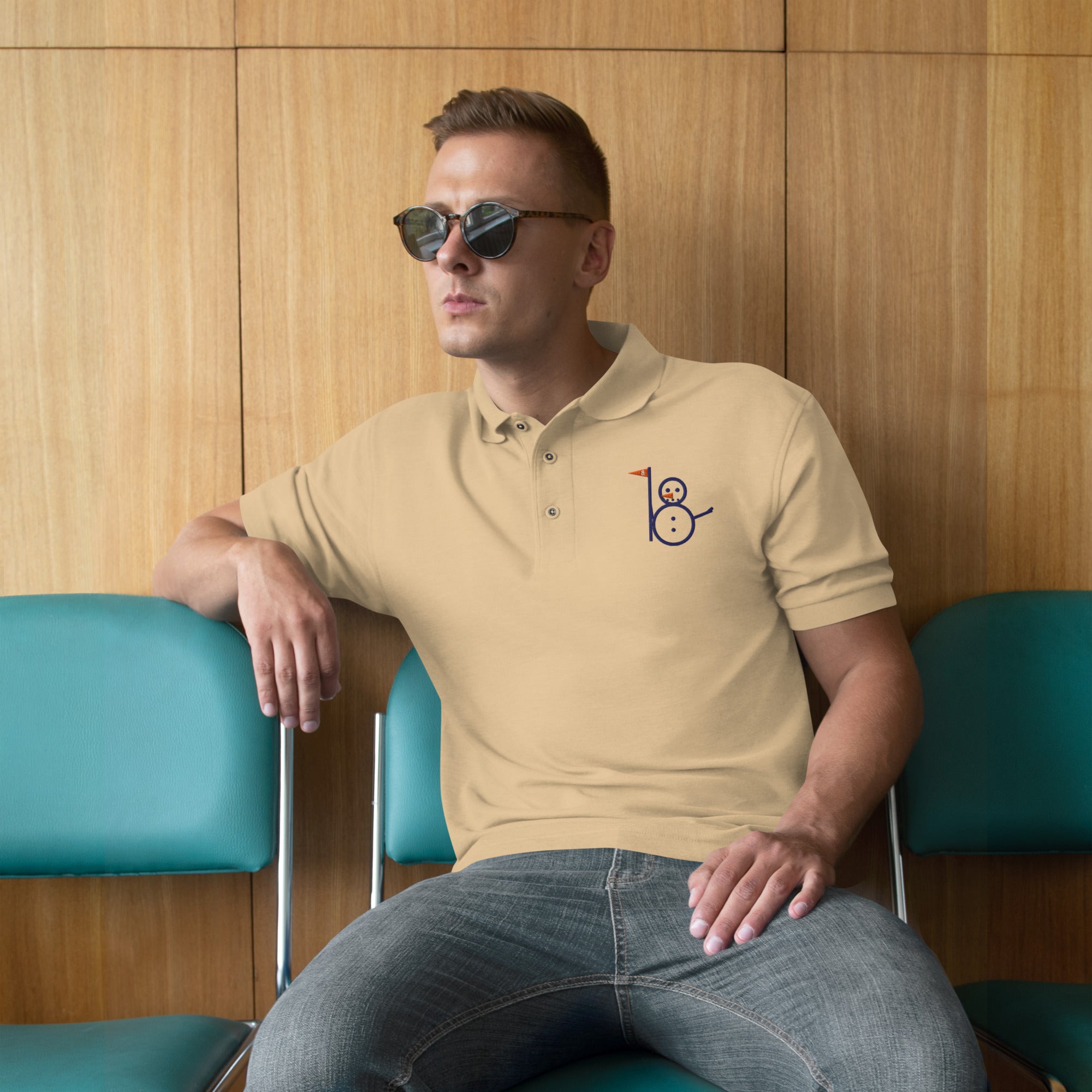 Stone Snowman Golf polo with embroidered snowman logo on the left chest